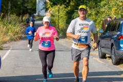 A man and woman run together at the Artful Dash 5K Run/Walk on the Karl Stirner Arts Trail in Easton, Pennsylvania.