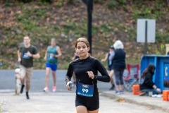 A youth runs by the blue McAteer Memorial Bridge at the Artful Dash 5K Run/Walk on the Karl Stirner Arts Trail in Easton, Pennsylvania.