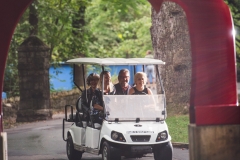 Golf cart taking people to Evening on the Trail event