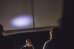 A woman speaks at a podium during the Karl Stirner Arts Trail gala.