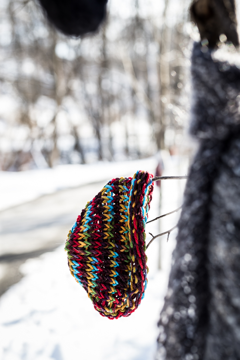 Chase the Chill knitted hat on branch