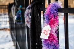 Chase the Chill knitted clothing on fence