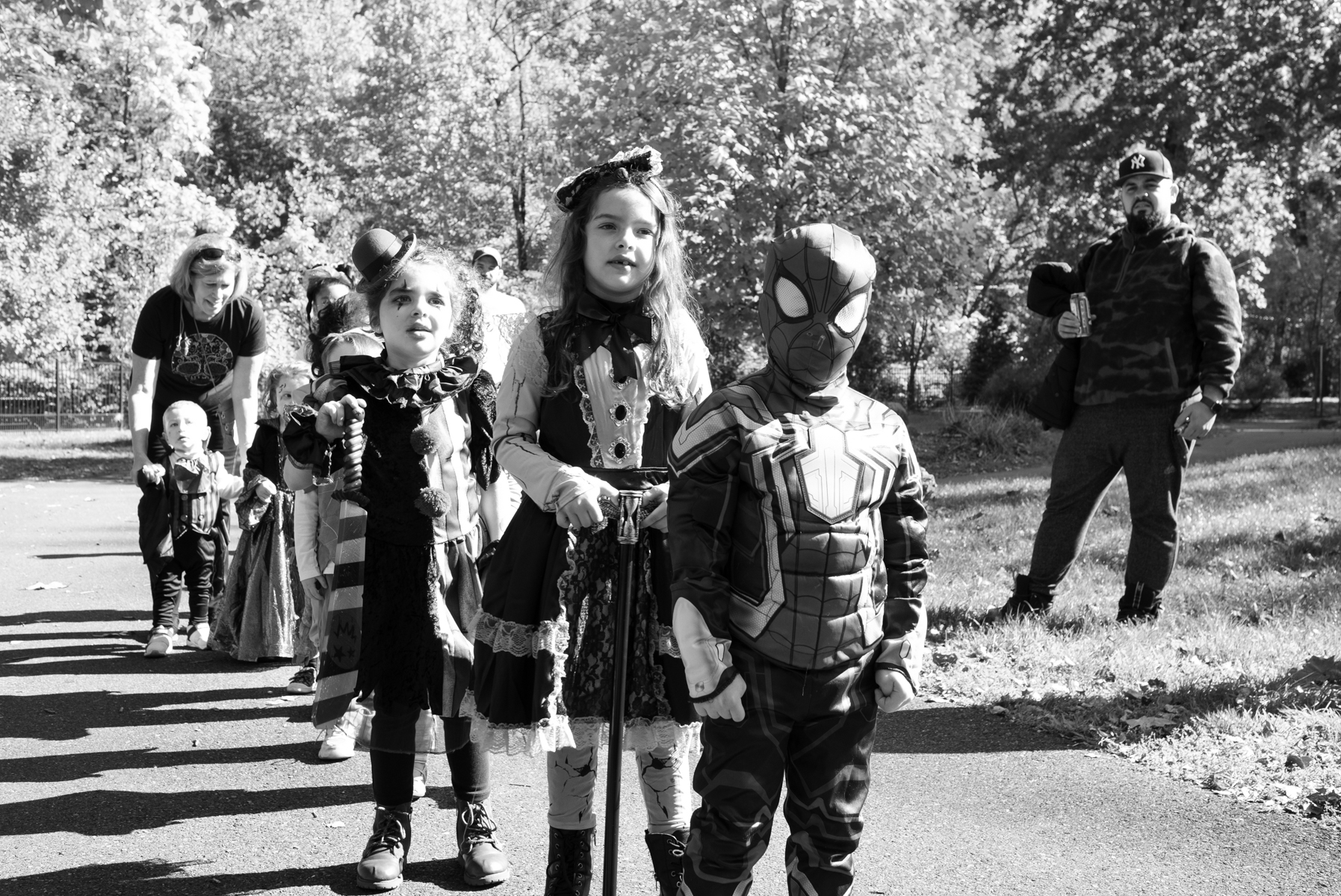 Children wearing costumes stand in a line at the Come as You Art event on the Karl Stirner Arts Trail.