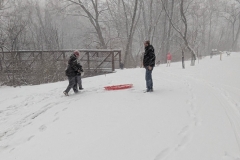 Sledders near the pedestrian bridge