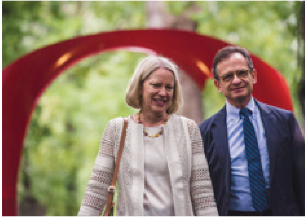 Dan and Sandra Weiss stand by the red arch sculpture on the Karl Stirner Arts Trail in Easton, Pennsylvania.