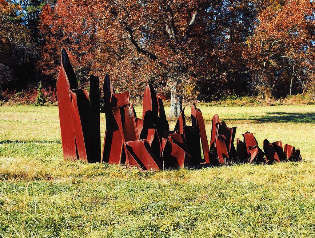 The sculpture Sprouts by Steve Tobin, comprised of roughly 20 scrap metal pieces, stands on the ground at the Karl Stirner Arts Trail in Easton, Pennsylvania.