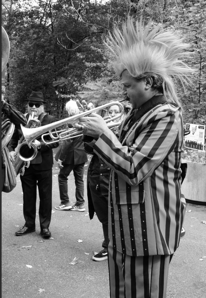 A trumpet player in the Big Easy Easton Brass band performs in costume at the Come As You Art/Arf parade on the Karl Stirner Arts Trail in Easton, Pennsylvania.