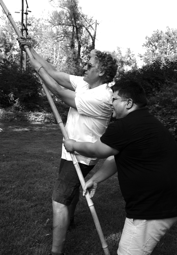 Nestor Gil and Ricardo Reyes hold the stick for a piñata during the LaJiraGira community picnic on the Karl Stirner Arts Trail in Easton, Pennsylvania.