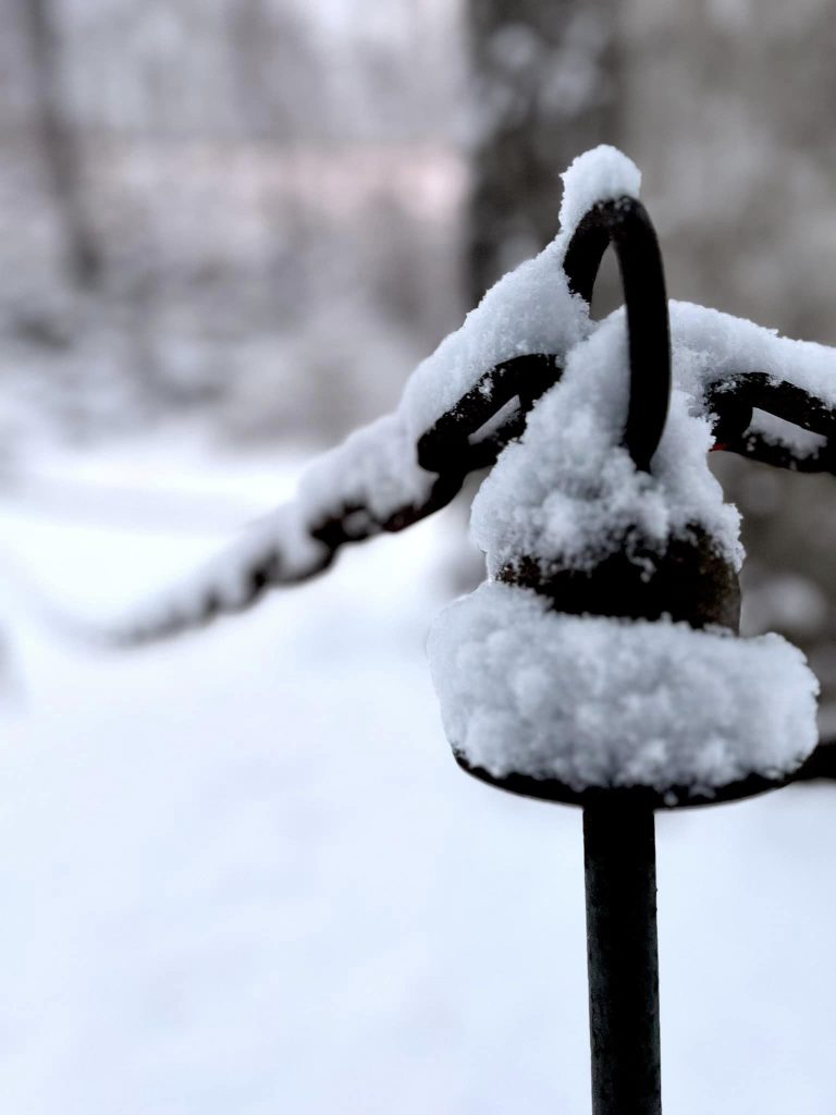 The post for a chain is covered by snow on the Karl Stirner Arts Trail in Easton, Pennsylvania.