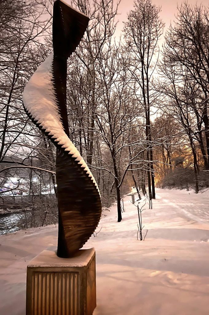 The sculpture Easton Ellipse, a vertical artwork twisting toward the sky, is covered by snow on the Karl Stirner Arts Trail in Easton, Pennsylvania.