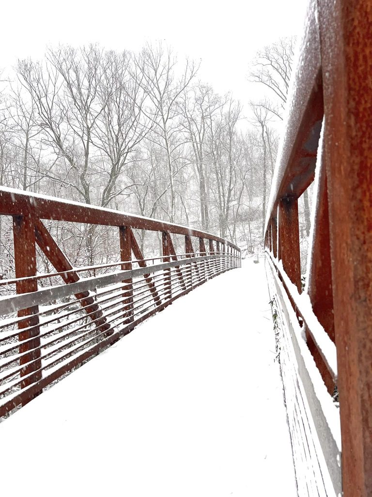 Snow covers the pedestrian bridge between the Silk complex and the Karl Stirner Arts Trail in Easton, Pennsylvania.
