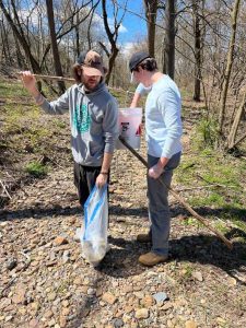 Two Lafayette College students stand together during a cleanup of the Karl Stirner Arts Trail in Easton, Pennsylvania.