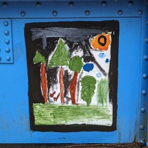 A painting of trees on grass covers a square on Young Masters Wall at the Karl Stirner Arts Trail in Easton, Pennsylvania.
