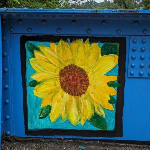 A painting of a sunflower covers a square on Young Masters Wall at the Karl Stirner Arts Trail in Easton, Pennsylvania.