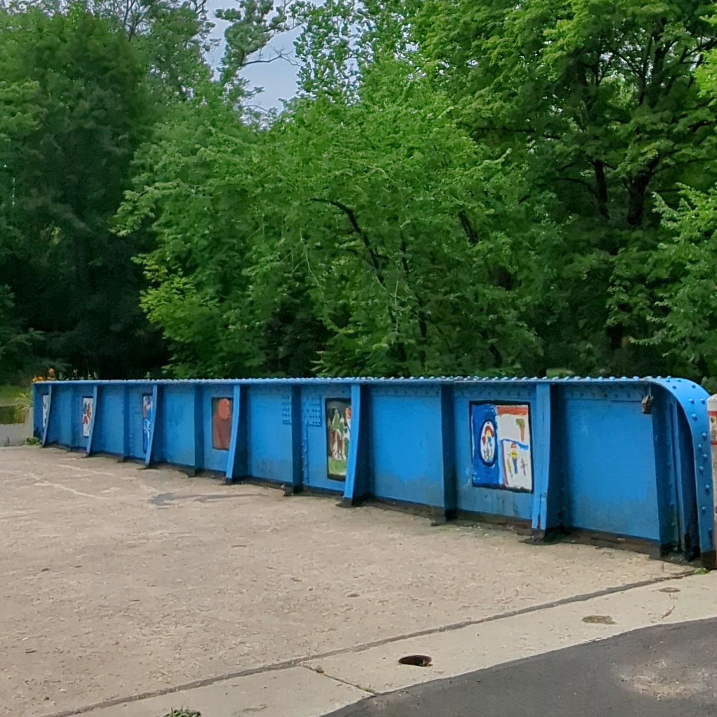 Pictures painted by children adorn the blue Young Masters Wall on the Richard McAteer Memorial Bridge, also known as the blue bridge, at the Karl Stirner Arts Trail in Easton, Pennsylvania.